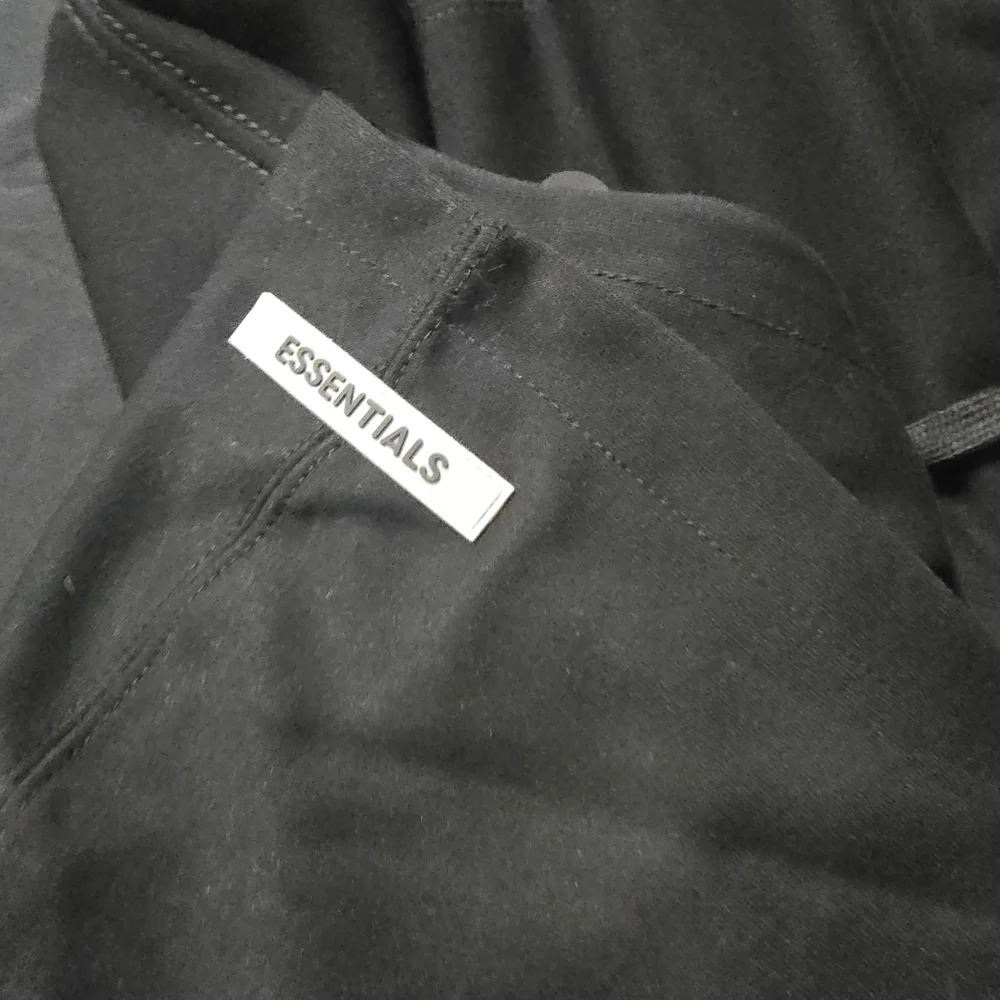 Essentials Black Hoodie - NWOT - Picture 2 of 3